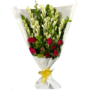 Roses and Rajanigandha in a bouquet
