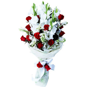 Red roses with gladiolus & rojonigondha in a bouquet
