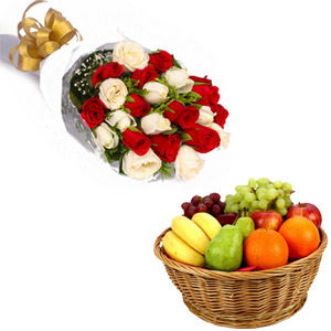 Mix roses in bouquet and fruits in basket