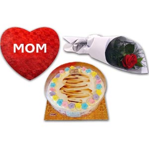 Cake with heart shape pillow and red rose