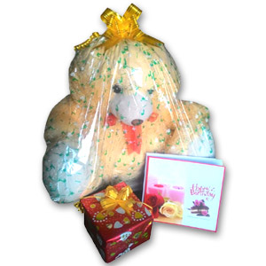 Teddy bear with card and mug