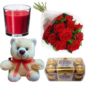 Red roses W/ chocolates, teddy bear & candle